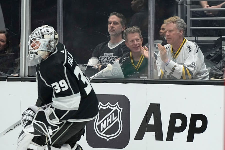 Actor Will Ferrell, right, watches as Los Angeles Kings goaltender Cam Talbot skates by during the first period of an NHL hockey game against the Colorado Avalanche Wednesday, Oct. 11, 2023, in Los Angeles. (AP Photo/Mark J. Terrill)
