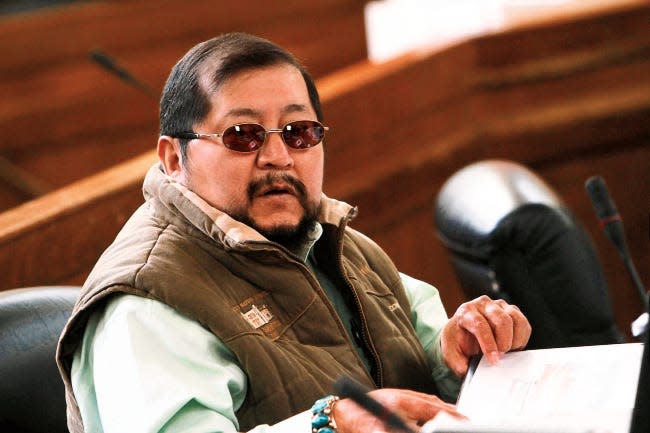 David L. Tom sits at his desk on Jan. 27, 2014 before the start of the winter session of the Navajo Nation Council at the council chambers in Window Rock, Arizona.