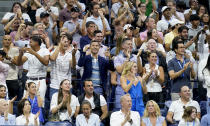 Tennis fans react during play between Serena Williams, of the United States, and Anett Kontaveit, of Estonia, during the second round of the U.S. Open tennis championships, Wednesday, Aug. 31, 2022, in New York. (AP Photo/Seth Wenig)