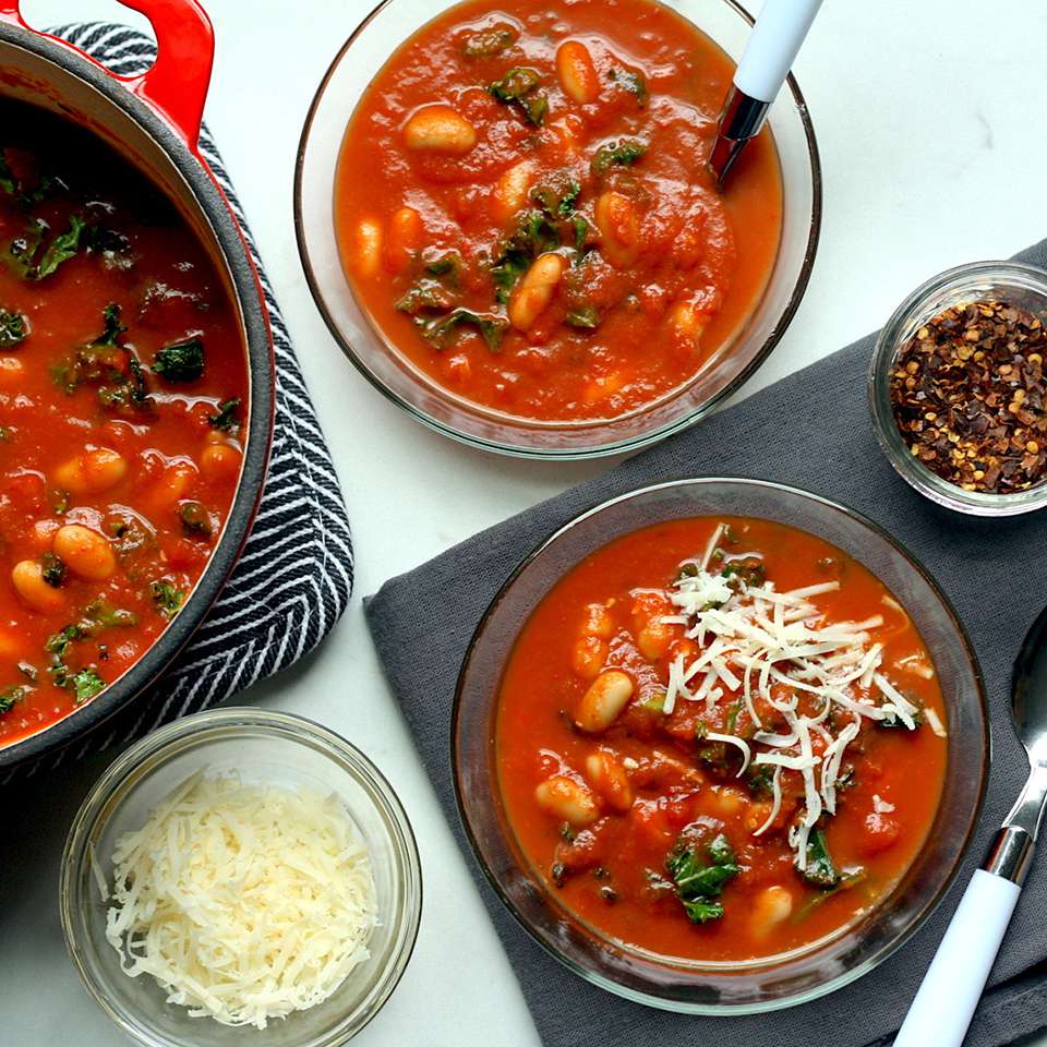 <p>Garlicky kale and creamy white beans elevate simple canned tomato soup into a 10-minute lunch or dinner that really satisfies. Use a soup with tomato pieces for a heartier texture. Look for a brand that's low- or reduced-sodium, with no more than 450 mg sodium per serving.</p> <p> <a href="https://www.eatingwell.com/recipe/269888/hearty-tomato-soup-with-beans-greens/" rel="nofollow noopener" target="_blank" data-ylk="slk:View Recipe;elm:context_link;itc:0;sec:content-canvas" class="link ">View Recipe</a></p>