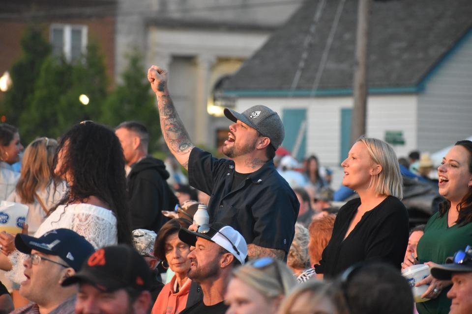 Concert attendees sing and dance along to Sammy Kershaw, Aaron Tippin and Collin Raye at Dockside’s inaugural “Dock Jam” on Saturday, May 20, 2023, in Pocomoke City, Maryland.