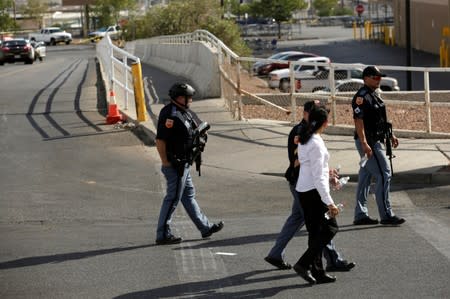 Police are seen after a mass shooting at a Walmart in El Paso