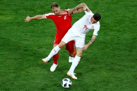 Soccer Football - World Cup - Group E - Serbia vs Switzerland - Kaliningrad Stadium, Kaliningrad, Russia - June 22, 2018 Switzerland's Steven Zuber in action with Serbia's Branislav Ivanovic REUTERS/Fabrizio Bensch