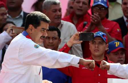 Venezuela's President Nicolas Maduro greets people during a rally in support of the government in Caracas, Venezuela May 20, 2019. REUTERS/Ivan Alvarado