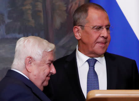 Russian Foreign Minister Sergei Lavrov and Syrian Foreign Minister Walid al-Moualem leave after a joint news conference following their talks in Moscow, Russia August 30, 2018. REUTERS/Maxim Shemetov