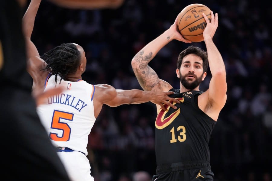 FILE - Cleveland Cavaliers guard Ricky Rubio looks to move the ball around New York Knicks guard Immanuel Quickley (5) in the first half of Game 4 in an NBA basketball first-round playoff series, April 23, 2023, at Madison Square Garden in New York. Rubio announced on Saturday, Aug. 5, that he is taking a break from basketball to focus on his mental health, a move that comes as his Spanish national team prepares to defend its title at the FIBA World Cup that starts later this month. (AP Photo/Mary Altaffer, File)