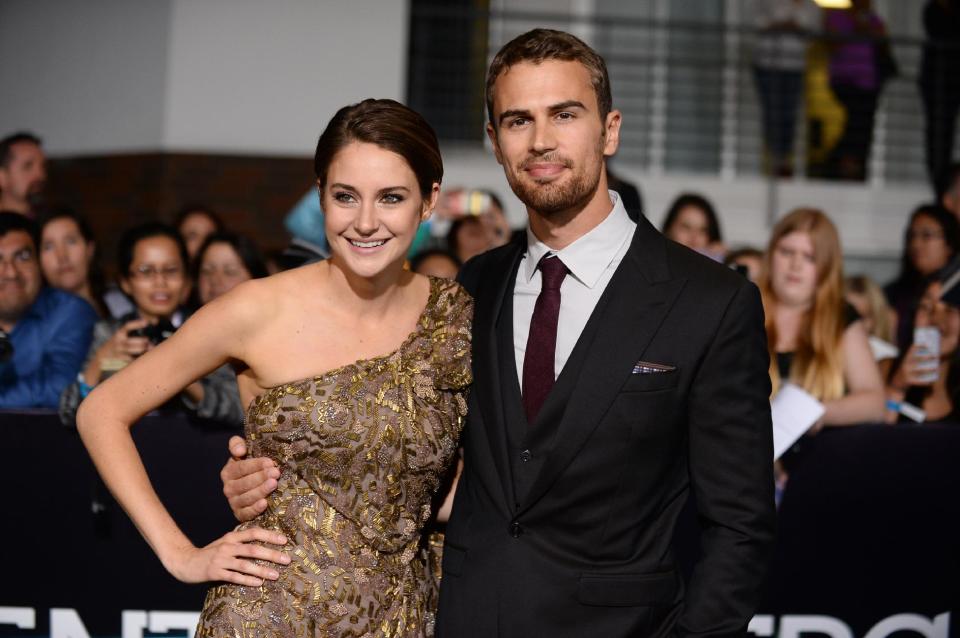 In this Tuesday, March 18, 2014 file photo, Shailene Woodley, left, and Theo James arrive at the world premiere of "Divergent" at the Westwood Regency Village Theater in Los Angeles. The soulful Brit James, the co-star of the buzzed about “Divergent,” is being set up as Hollywood next heartthrob. The film adaptation of Veronica Roth’s sci-fi best-seller hits theaters on Friday, March 21, 2014. (Photo by Jordan Strauss/Invision/AP, file)