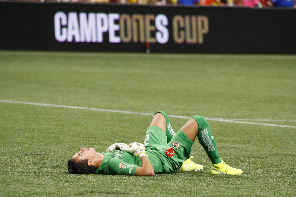 America goalkeeper Oscar Jimenez lies on the pitch after the team's 3-2 loss to Atlanta United in the Campeones Cup soccer final Wednesday, Aug. 14, 2019, in Atlanta. (AP Photo/John Bazemore)