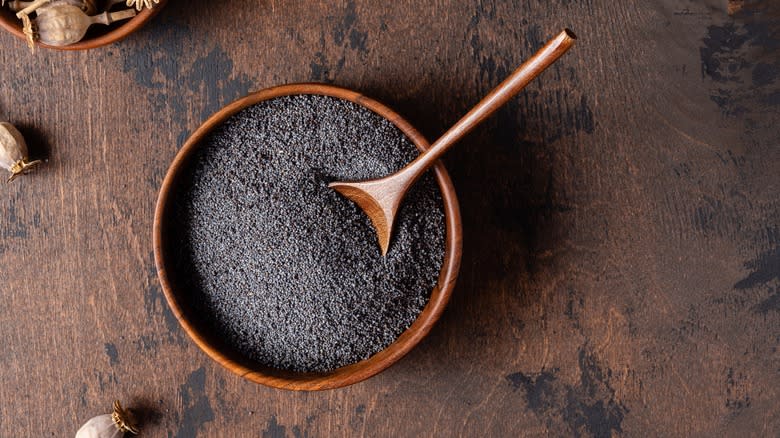 Wooden bowl of poppy seeds