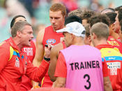 Gold Coast coach Guy McKenna tries to inspire his troops against Melbourne