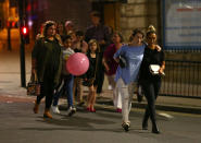 <p>Members of the public are escorted from the Manchester Arena on May 23, 2017 in Manchester, England. There have been reports of explosions at Manchester Arena where Ariana Grande had performed this evening. Greater Manchester Police have have confirmed there are fatalities and warned people to stay away from the area. (Dave Thompson/Getty Images) </p>