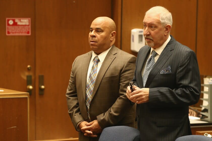 LOS ANGELES, CA - MARCH 16: Attorney Mark Geragos (R) stands with his client Matthew Fletcher during his arraignment hearing at Criminal Courts Building on March 16, 2018 in Los Angeles, California. Matthew Fletcher and Thaddeus Culpepper, both attorneys for Marion "Suge" Knight, were indicted on charges of conspiring to bribe witnesses and obstruct justice while representing Knight during his murder case. (Photo by Frederick M. Brown/Getty Images)