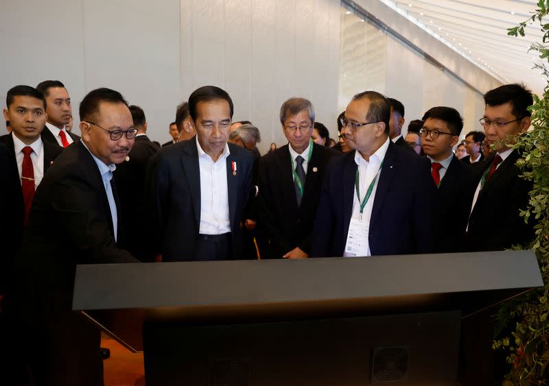 Indonesia's President Joko Widodo looks at a video presentation of the planned new capital Nusantara, at Ecosperity Week in Singapore