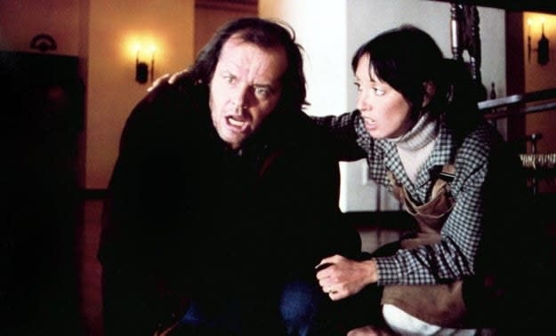 A man and a woman looking disturbed in "The Shining"