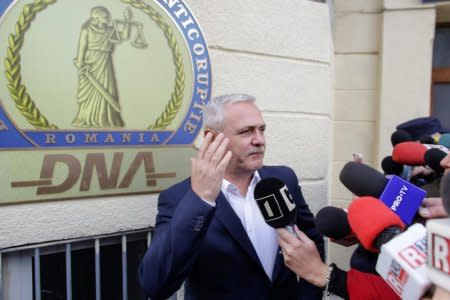 FILE PHOTO: Social Democrat Party leader Liviu Dragnea gestures after leaving the Romanian anti-corruption prosecutors headquarters in Bucharest, Romania, November 13, 2017. Inquam Photos/Octav Ganea/via REUTERS