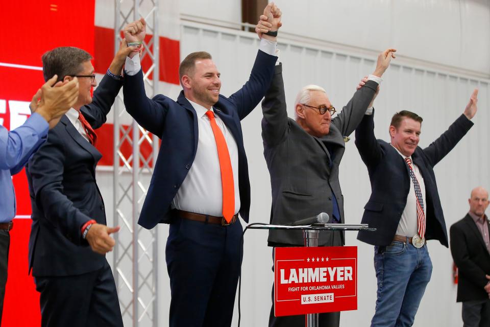 From left, Michael Flynn, U.S. Senate candidate Jackson Lahmeyer, Roger Stone and former Oklahoma Republican Party Chair John Bennett, a 2nd Congressional District candidate, stand March 4 after a rally for Lahmeyer in Oklahoma City.