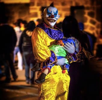 Creepy, whispering clowns have reportedly been spotted lurking in the woods, luring in children. Photo: Getty