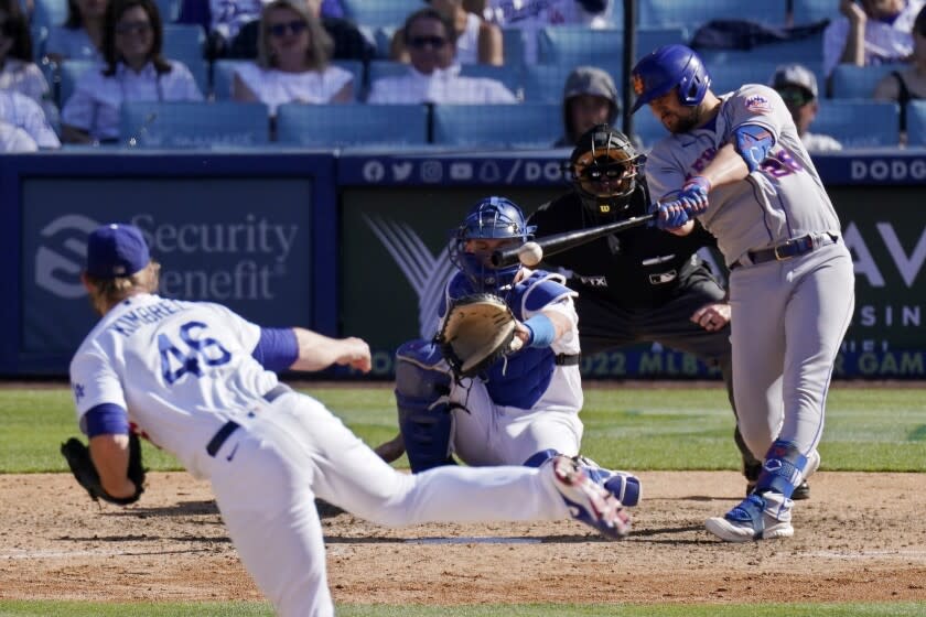 New York Mets' J.D. Davis, right, hits an RBI double as Los Angeles Dodgers relief pitcher Craig Kimbrel.