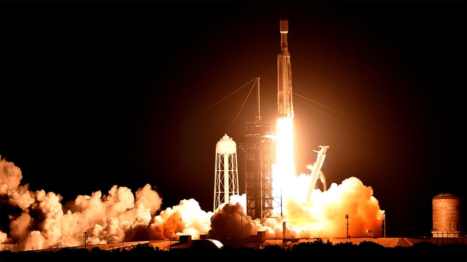 SpaceX launched its sixth Falcon Heavy rocket Sunday, using the company's most powerful operational booster to put a third-generation ViaSat internet satellite into orbit along with two smaller hitchhiker satellites. / Credit: William Harwood/CBS News