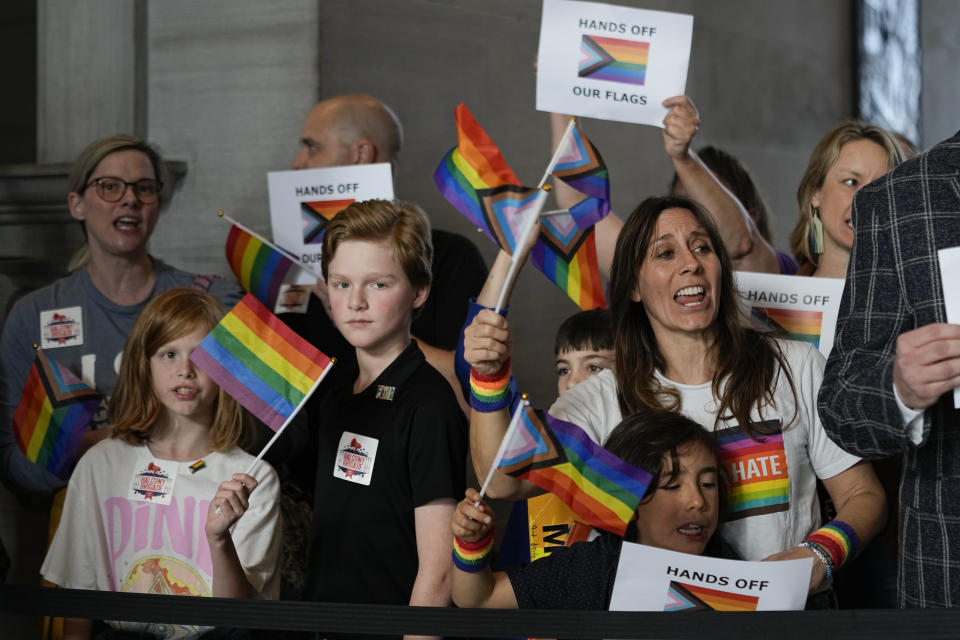 Demonstrators protest against a bill that would ban the Pride Flag from being displayed in schools, outside the House chamber before a legislative session Monday, Feb. 26, 2024, in Nashville, Tenn. (AP Photo/George Walker IV)