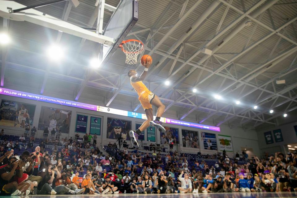 Life Christian's Hansel Enmanuel Donato (24) dunks the ball during the 2021 City of Palms Classic Edison Bank SLAM DUNK Contest, Sunday, Dec. 19, 2021, at Suncoast Credit Union Arena in Fort Myers, Fla.Life Christian's Hansel Enmanuel Donato (24) won the slam dunk contest.