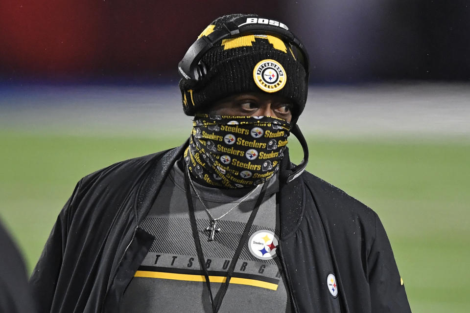 FILE - Pittsburgh Steelers head coach Mike Tomlin walks on the sideline during the first half of an NFL football game against the Buffalo Bills in Orchard Park, N.Y., in this Sunday, Dec. 13, 2020, file photo. The Steelers have the 24th overall pick in the draft and could use it to find a replacement for longtime Pro Bowl center Maurkice Pouncey, who retired during the offseason.(AP Photo/Adrian Kraus, File)