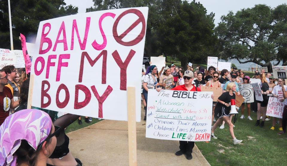 Lone anti-abortion supporter Doug Stauffer mingles amid hundreds of people protesting the Supreme Court striking down of Roe v. Wade during Tuesday's pro choice rally and march through downtown Fort Walton Beach.