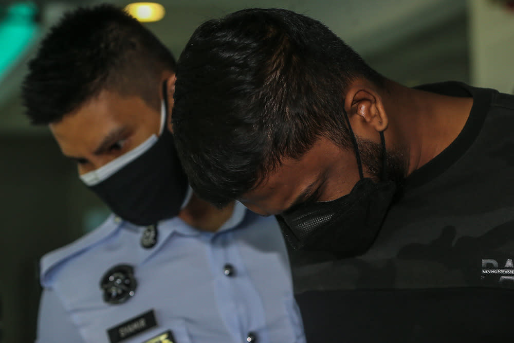 Devaaswin Krishnan arrives at the Shah Alam High Court to be charged with the murder of two youths following a fatal accident along Federal Highway on September 12. — Picture by Yusof Mat Isa