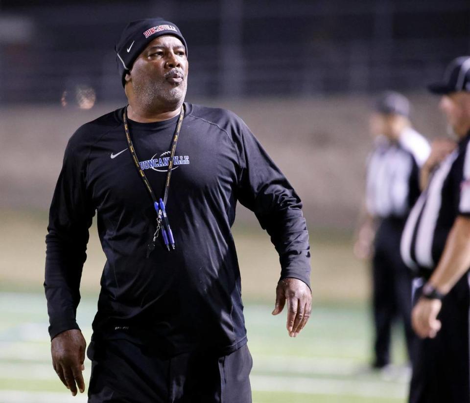 Duncanville head coach Reginald Samples walks the side lines late in the second half of a UIL high school football game at Vernon Newsom Stadium in Mansfield, Texas, Thursday, Oct. 12, 2023.