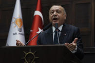 Turkey's President Recep Tayyip Erdogan addresses his ruling party MPs, in Ankara, Turkey, Tuesday, June 25, 2019, two days after Ekrem Imamoglu, the candidate of the secular opposition Republican People's Party, won the election for mayor of Istanbul. Erdogan addressed his AK Party's weekly meeting, the first time he speaks since the Istanbul mayoral election Sunday, which was a big setback for him and his party.(AP Photo/Burhan Ozbilici)