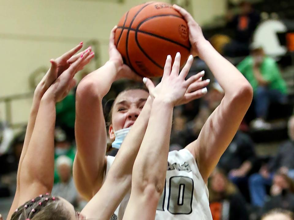 Galesburg senior Abby Davidson puts up a shot in traffic on Thursday night against No. 1 ranked Geneseo in Western Big 6 play at John Thiel Gymnasium.