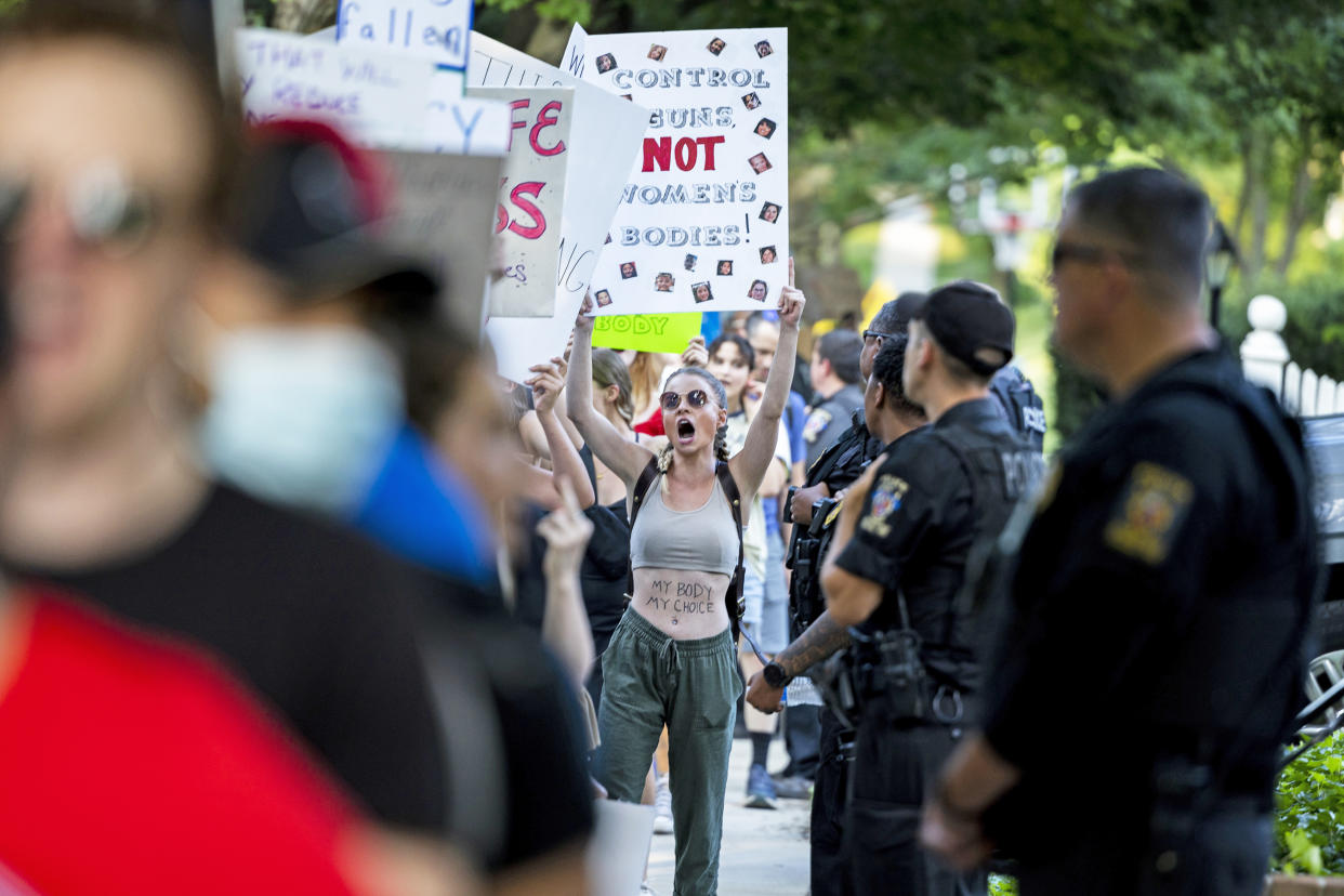 Abortion rights activists march in front of Supreme Court Justice Brett Kavanaugh's house i (Anna Moneymaker / Getty Images file)