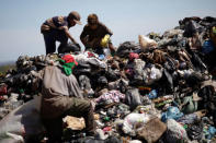 Children work at 'Lixao da Estrutural', Latin America's largest rubbish dump, in Brasilia, Brazil, January 19, 2018. REUTERS/Ueslei Marcelino