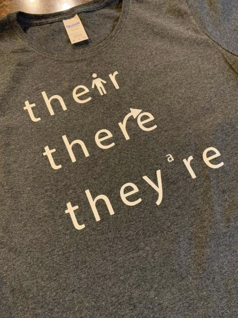 A shirt with "their," "there," and "they're"