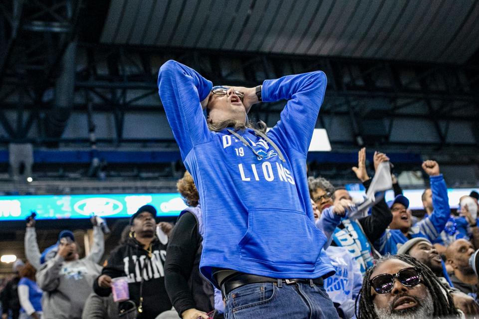 A fan reacts to a missed play leading to a punt during the Detroit Lions NFC Championship watch party at Ford Field in Detroit on Sunday, Jan. 28, 2024.