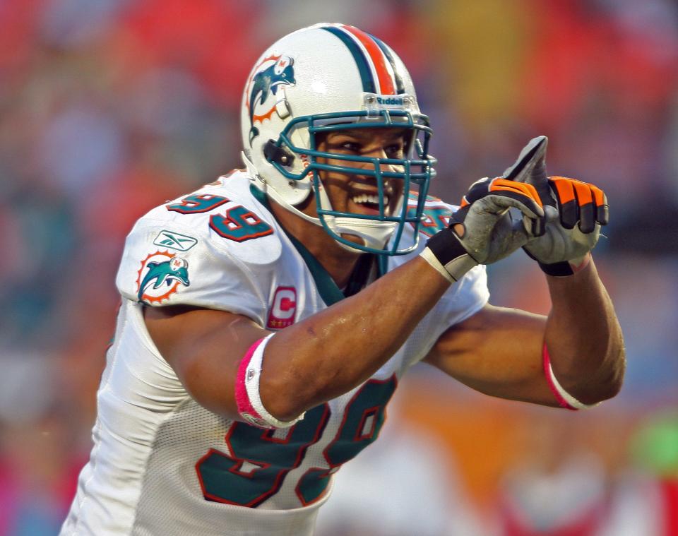 Miami Dolphins linebacker Jason Taylor celebrates the first of his two fourth-quarter sacks against the Buffalo Bills, Oct. 4, 2009.