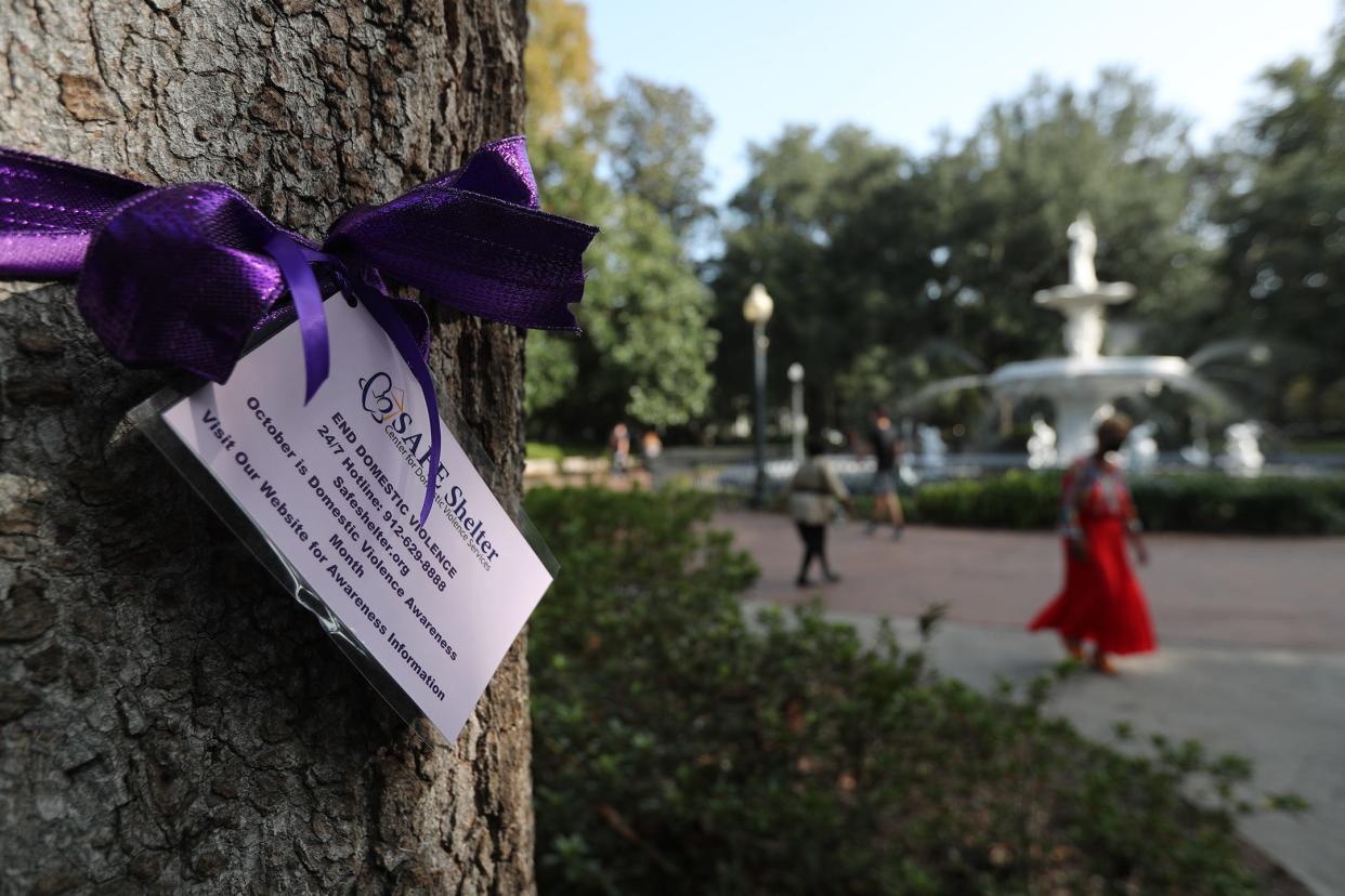 SAFE Shelter staff and volunteers tied purple ribbons around trees in Forsyth Park on Monday, October 2, 2023 in honor of domestic violence awareness month.