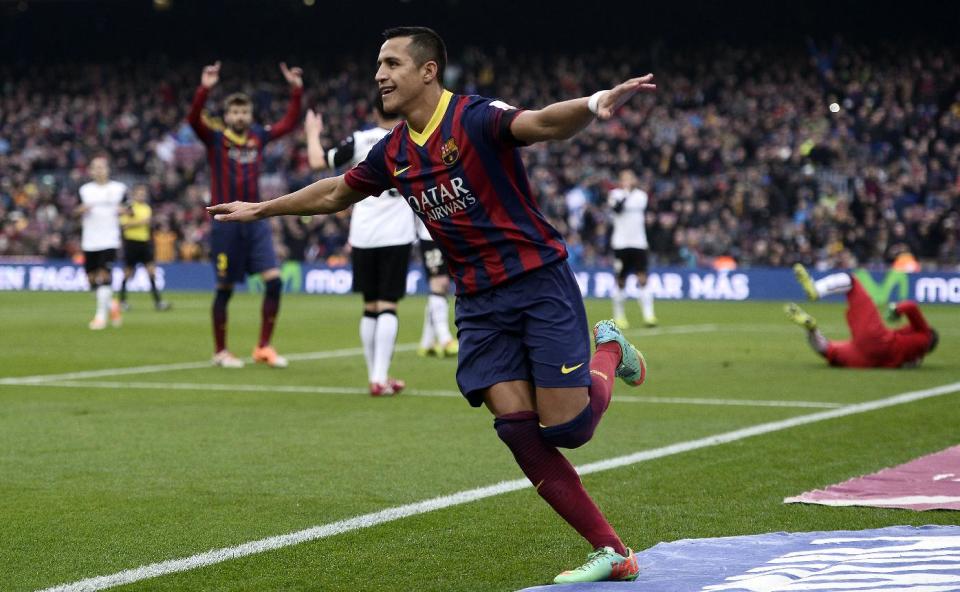 FC Barcelona's Alexis Sanchez, from Chile, reacts after scoring against Valencia during a Spanish La Liga soccer match at the Camp Nou stadium in Barcelona, Spain, Saturday, Feb. 1, 2014. (AP Photo/Manu Fernandez)