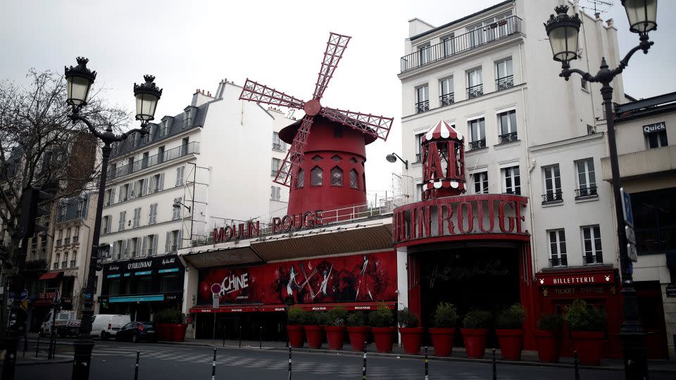 What the world famous cabaret club usually looks like when its eponymous red windmill is securely intact. - Benoit Tessier/Reuters