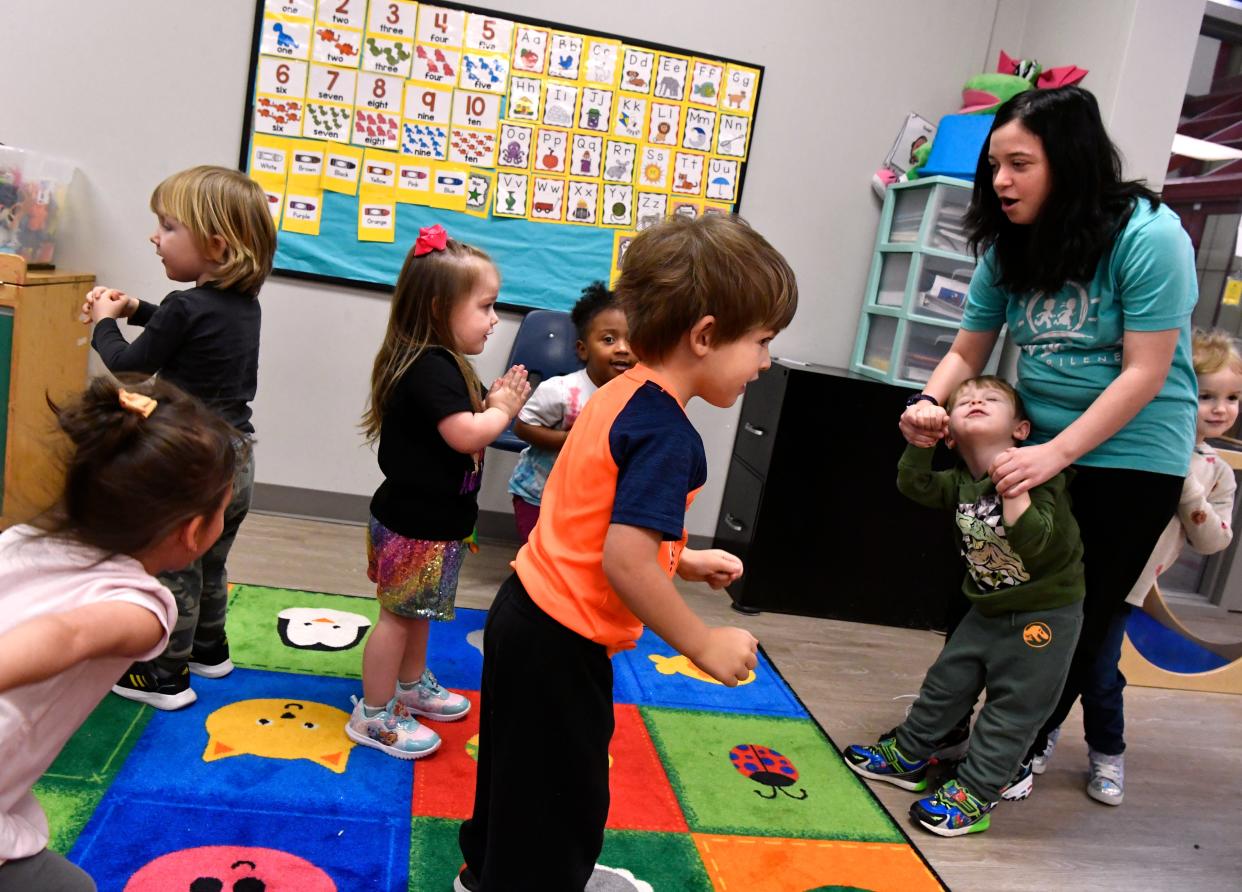 Serena Siedel leads 2- and 3-year-olds in a dance to “Baby Shark” at the Cedar Street Day Nursery of Abilene on Thursday. The location was the first built by the nonprofit.