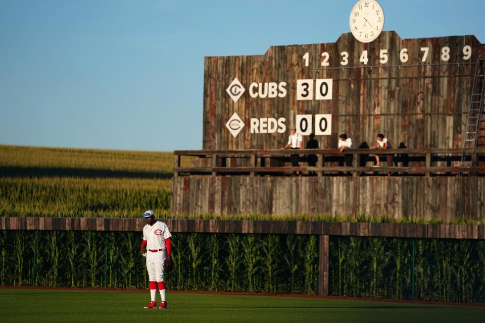 Cincinnati Reds right fielder Aristides Aquino (44) stands in right field during a baseball game against the Chicago Cubs, Thursday, Aug. 11, 2022, at the MLB Field of Dreams stadium in Dyersville, Iowa.