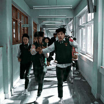 bloody students running down a hallway with weapons