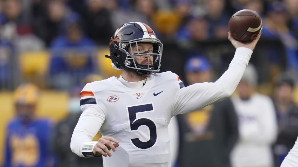 Virginia quarterback Brennan Armstrong (5) plays against Pittsburgh an NCAA college football game, Saturday, Nov. 20, 2021, in Pittsburgh. (AP Photo/Keith Srakocic)