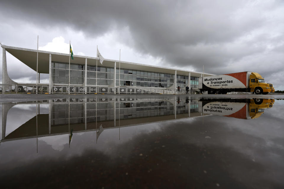 A moving truck is parked outside Planalto presidential palace in Brasilia, Brazil, Friday, Dec. 16, 2022. President-elect Luiz Inácio Lula da Silva will be sworn-in on Jan. 1, 2023. (AP Photo/Eraldo Peres)