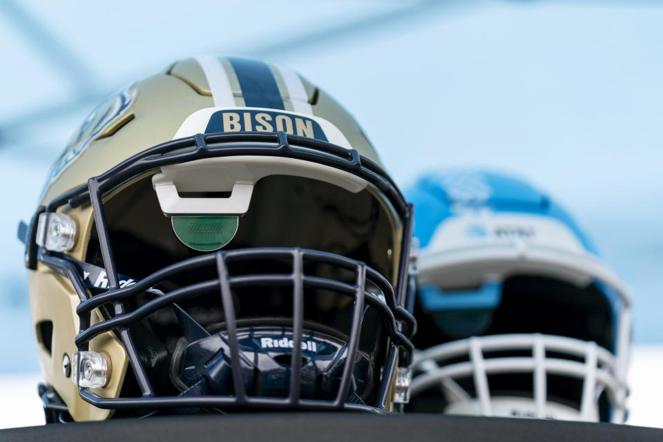 Football helmets that help Deaf and hard-of-hearing players see play calls on a lens inside are displayed before an NCAA college football game between the Gallaudet and Hilbert College, Saturday, Oct. 7, 2023, in Washington. (AP Photo/Stephanie Scarbrough)