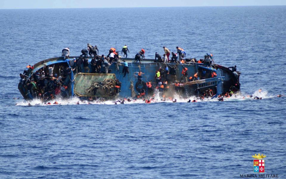 At least seven migrants have drowned after a heavily overcrowded boat they were sailing on overturned in May 2016 - Credit: AFP