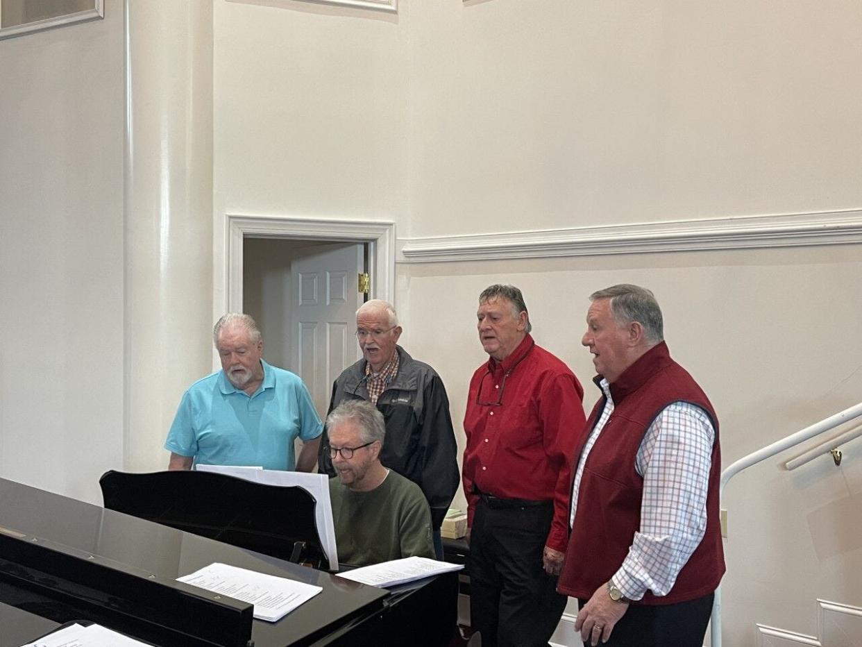 Warren Jarman (left), Donnie Avery (second from left), Marshall Jarman (second from right), Tim Jarman (right) and Michael Jarman (piano) practice for their upcoming reunion concert on March 11.