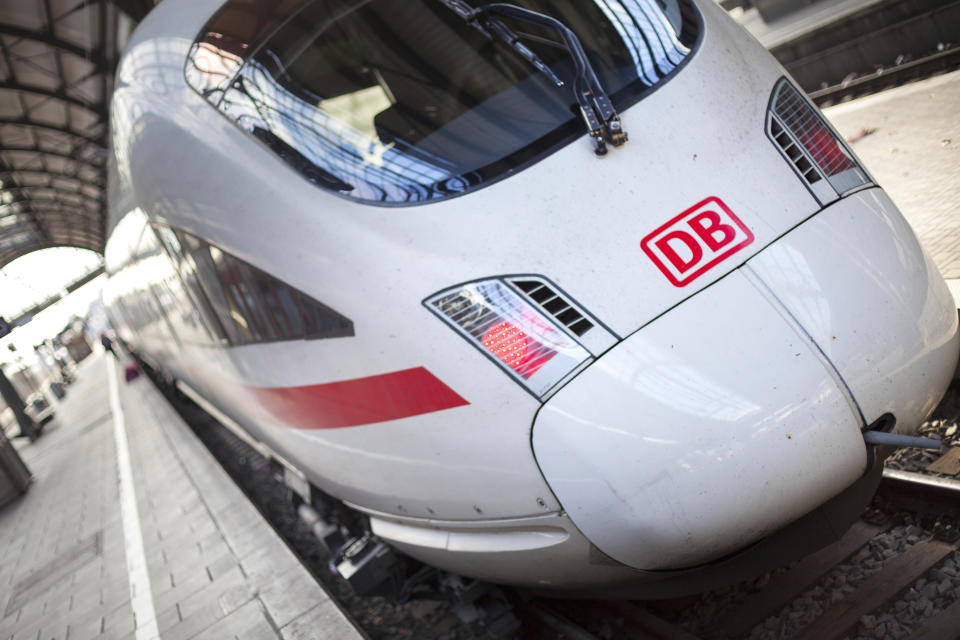 An ICE train waiting for its departure at main station Wiesbaden, Germany. ICE, formerly known as InterCityExpress is a highspeed train system in Germany. The pictured train connects the cities Wiesbaden in the west and Leipzig in the East of Germany. Deutsche Bahn AG (DB) is a national railway company in Germany and headquartered in Berlin. DB is the successor to the former state railways of Germany (Deutsche Bundesbahn)