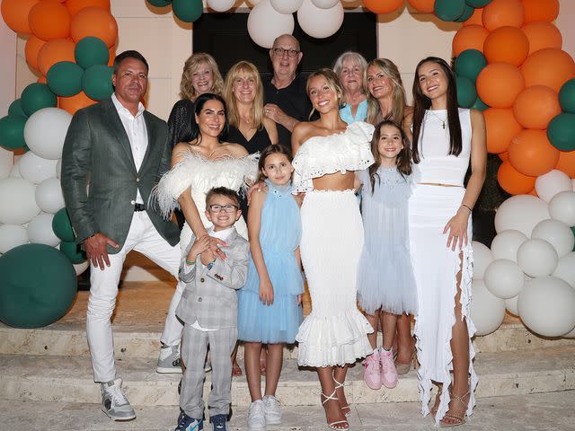 <p>Alexander Tamargo/Getty</p> Alex Earle celebrates her University of Miami graduation with her family