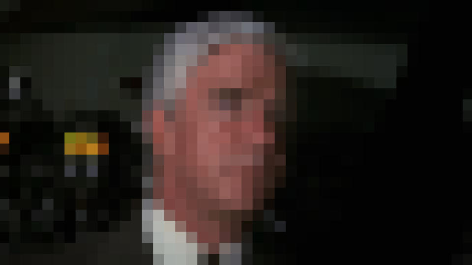 Leslie Nielsen standing in the cockpit in Airplane!, pixelated.